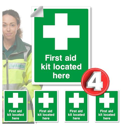 Set of first aid kit location signs with a woman in a high-visibility jacket.