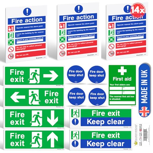 Set of fire safety signs including 'Fire exit', 'Fire door keep shut', and 'First aid' with packaging.